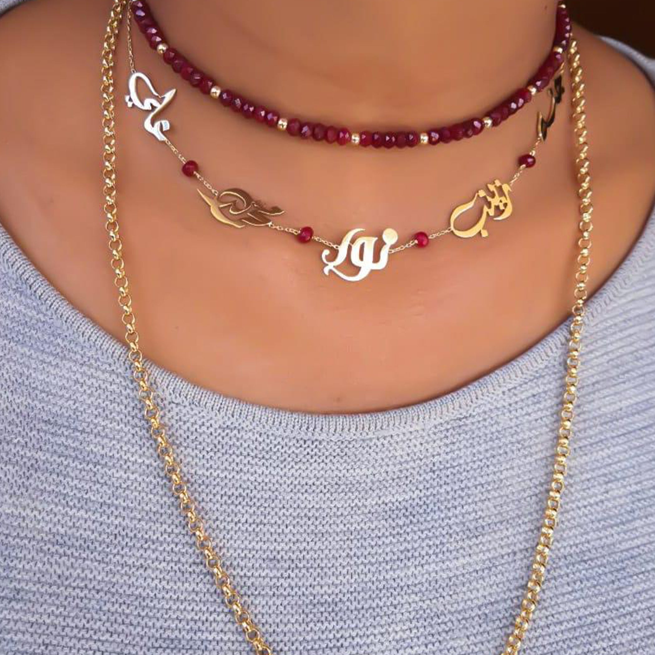 Gold Family Name Design with Natural Ruby Stone